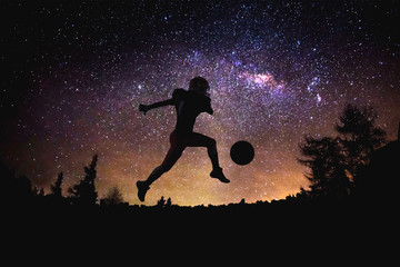 player american football man jumping silhouette at the night starry sky and moon background.