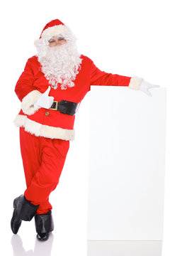 Santa Claus standing with thumbs up or ok isolated on white background. Full length portrait