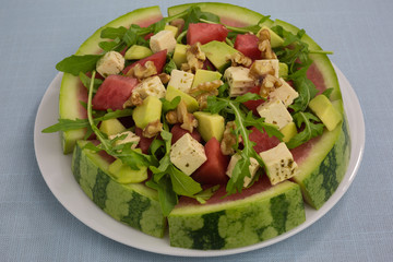 salad of watermelon with avocado and feta with rocket
