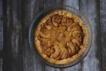 Homemade apple quince pie on rustic wooden background. Top view