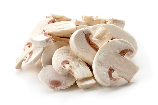 Sliced champignons, close-up, isolated on white background.