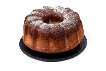 Cake of chocolate and vanilla on stone plate, isolated on white background.
