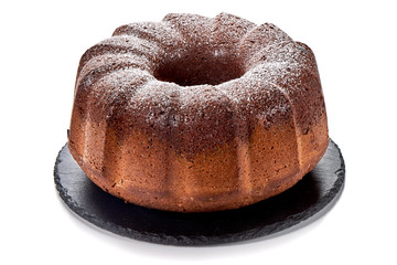 Cake of chocolate and vanilla on stone plate, isolated on white background.