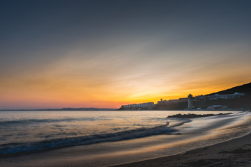 Fototapeta na wymiar Colorful sunset over sea bay beach in Bulgaria with Nessebar city in cinematic look.