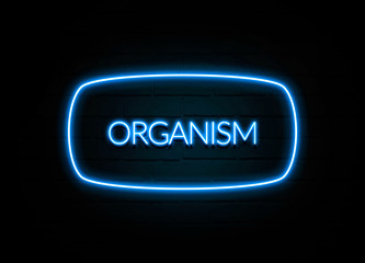 Organism  - colorful Neon Sign on brickwall