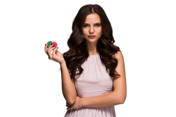 Sexy curly hair brunette posing with chips in her hands, poker concept isolation on white background