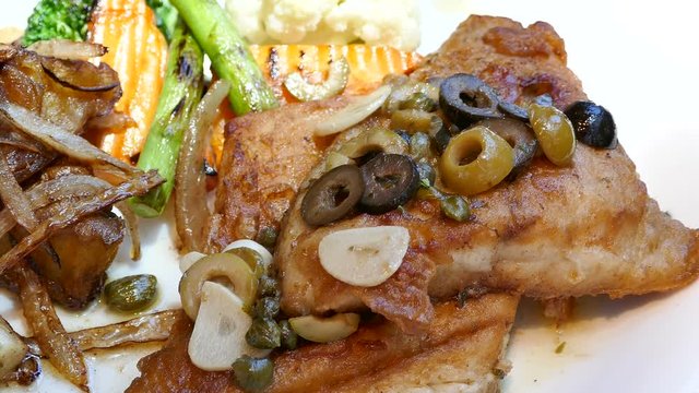 Sea bass steak with sauce
