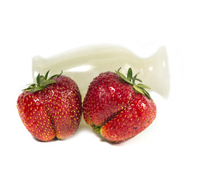 strawberry, ripe red berries and marble vase