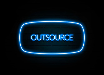 Outsource  - colorful Neon Sign on brickwall