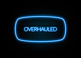Overhauled  - colorful Neon Sign on brickwall