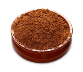 pile cocoa powder and clay bowl isolated on white background