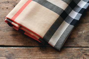 Cosy scarf on wooden table