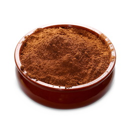 pile cocoa powder and clay bowl isolated on white background