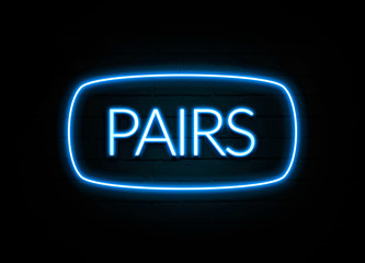 Pairs  - colorful Neon Sign on brickwall