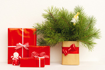 Present with fir tree brunch in the vase