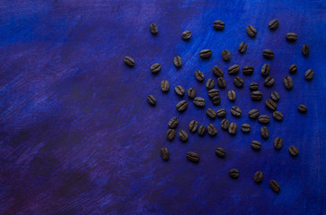 Grains of coffee on a beautiful blue background hand-painted, background, space for text.