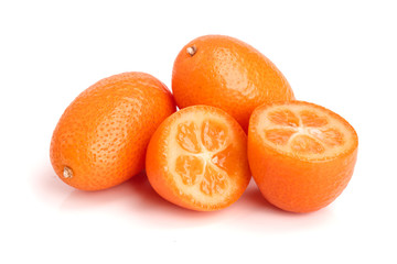 Cumquat or kumquat with half isolated on white background close up