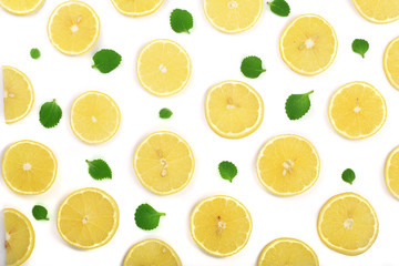 Fototapeta premium Slices lemon with mint leaves isolated on white background. Flat lay, top view