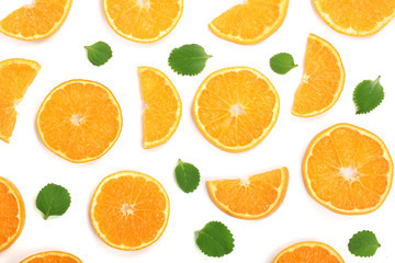 Fototapeta na wymiar Slices of orange or tangerine with mint leaves isolated on white background. Flat lay, top view. Fruit composition