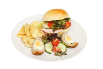 Ham salad roll and garnish