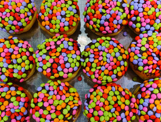 Close up of fresh colorful donuts for Hanukkah celebration.