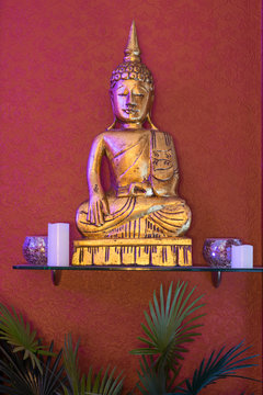 Statue of Buddha. Decoration in interior.