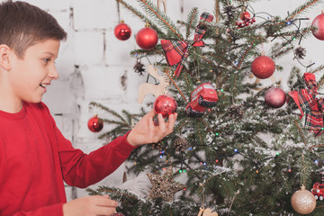 Boy new year with presents in hands
