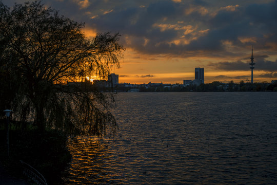 sunset panorama over the lake Alster into the city of Hamburg Germany