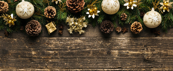 Christmas Background, Fir Tree Branches With Pine Cones, Xmas Baubles and Decorations On Wooden Background, Festive Concept With Copy Space - obrazy, fototapety, plakaty