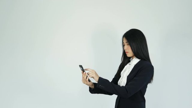 4k of young business woman using Smartphone a touch screen on white background. blank copy space