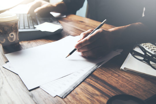 businessman hand document with computer