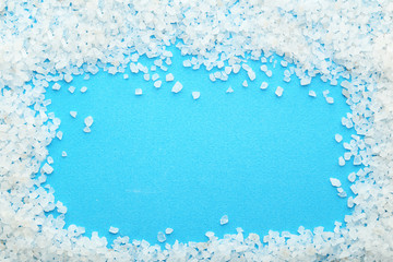 White sea salt on blue background