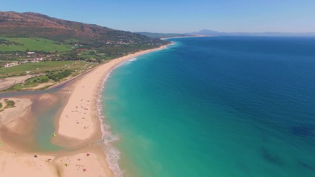 Aerial view of a big dune sand with ocean and Africa coast behind it. Delightful beach with nobody