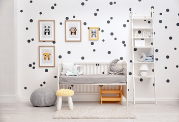 Baby bedroom decorated with pictures of animals
