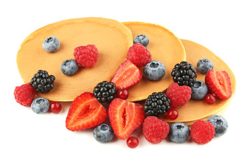 Tasty pancakes with berries isolated on white
