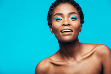African woman with blue eye shadow