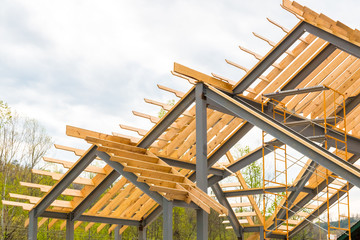 Fototapeta na wymiar Steel frame with wooden beams construction.