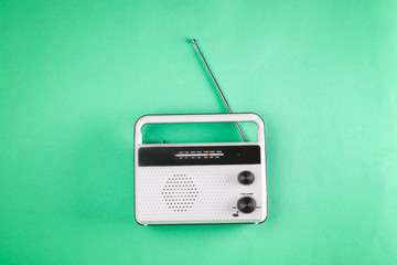 Retro radio on color background