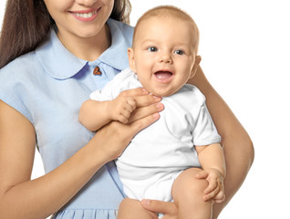 Happy young woman with cute baby on white background