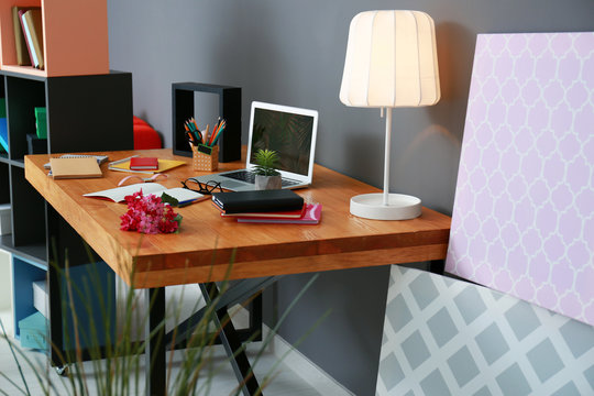 Comfortable workplace with laptop on table