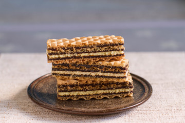 Waffles layered cake with condensed milk, vanilla and chocolate cream