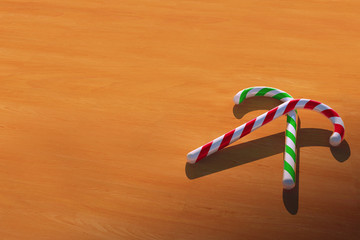 Candy Canes on Wooden Table Greeting Card Background Illustration