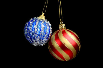 Red and Blue Christmas Tree Ornament, ball, decorations. Isolated black background.
