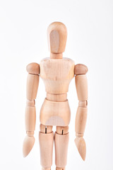 Human wooden dummy standing over white. Wooden figurine isolated on white background.