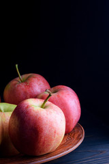 Beautiful juicy apples in a plate on a table