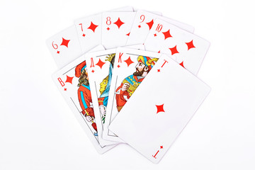 Royal flush in diamonds, white background. Diamonds royal flush in playing cards isolated on white. Classic playing paper cards.