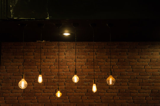 Light bulbs on brick wall
