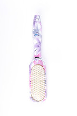Hair brush with floral print. Elegant female comb isolated on white background.