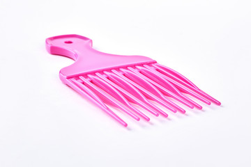 Professional afro comb for hairdresser. Plastick hair pick isolated on white background. Professional equipment for barbers.