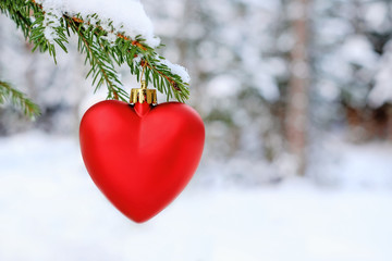 Red heart on Christmas tree